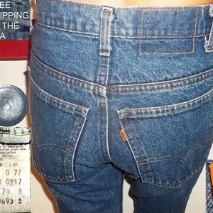 Levis slim fit jeans 519 vintage indigo denim original USA made chain stitched hems 27x28 gently slightly worn collectible free US shipping