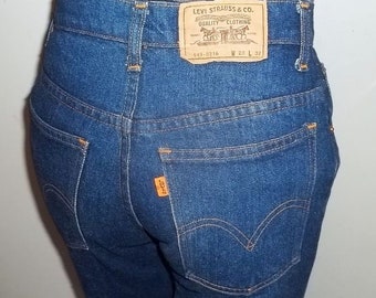 Levis bell bottom jeans model 649 blue denim dark indigo 28x31.5 slightly worn very good laundered collectible new LOWERED PRICE