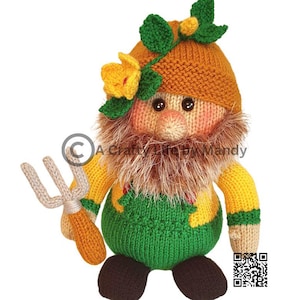 May include: A crocheted gnome doll wearing a green and yellow outfit, a brown hat with green leaves, and a brown beard. The gnome is holding a small rake in its hand.