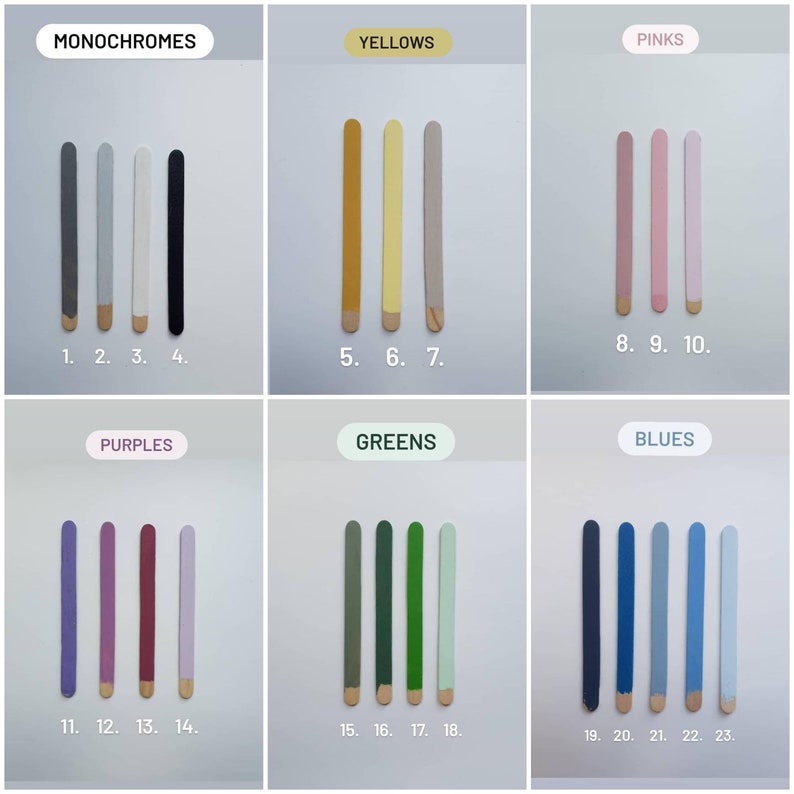 May include: A chart with 23 color swatches arranged in rows labeled "Monochromes", "Yellows", "Pinks", "Purples", "Greens", and "Blues". Each color swatch is a wooden stick painted with a different shade of the color group.