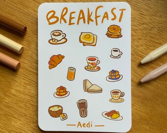 May include: A sheet of stickers with a breakfast theme. The stickers feature various breakfast foods, including croissants, pancakes, coffee, juice, and toast. The sheet is white with a light blue border and the word "BREAKFAST" in orange letters at the top. The sheet is signed "Aedi" at the bottom.