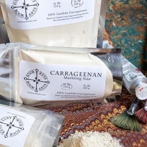 May include: Several packages of Carrageenan marbling size, with labels displaying the Four Keys Book Arts logo and product information. The packages contain 1/4 lb (114 g) and 1/2 lb (228 g) of the product. A small pile of the powder is visible.