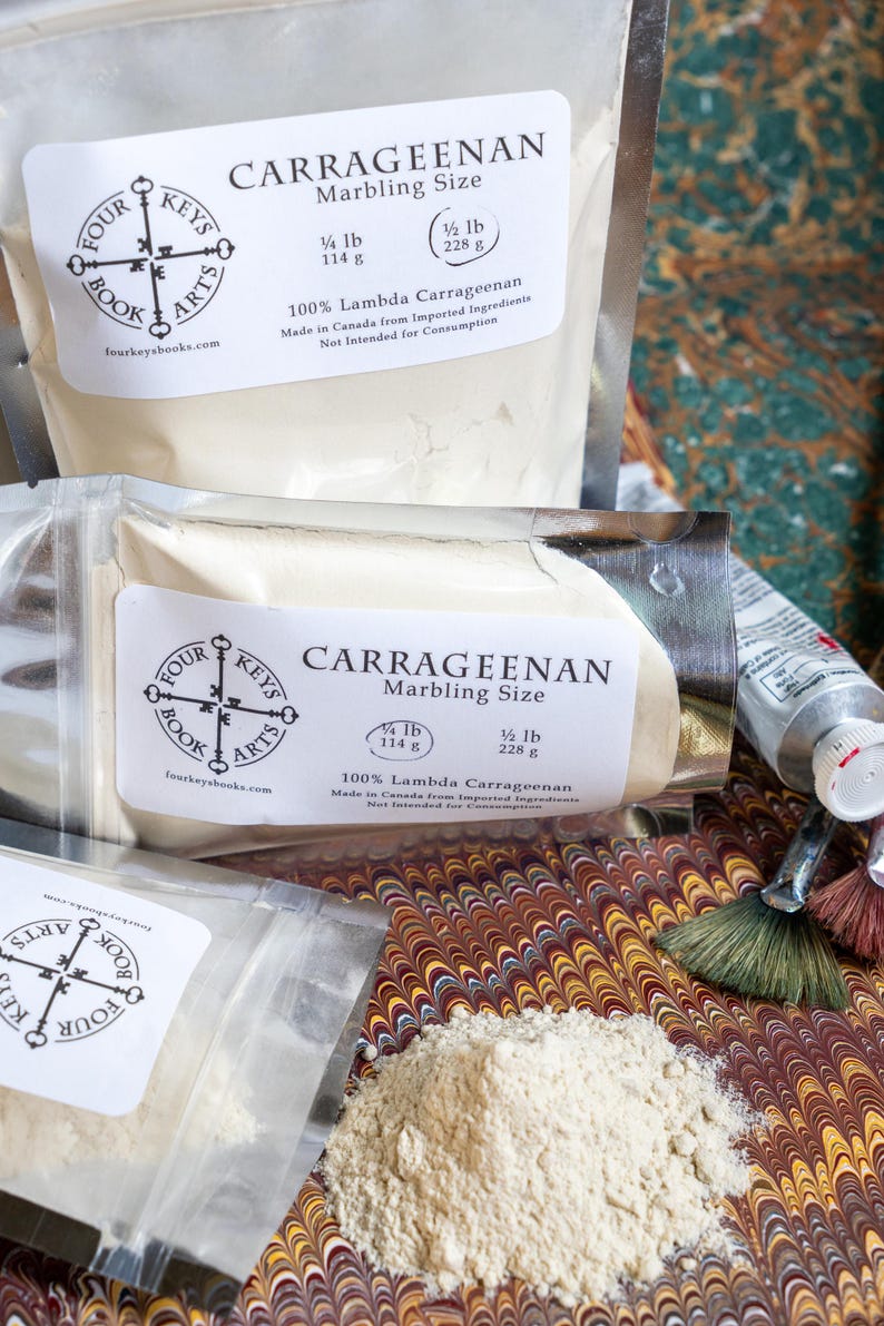 May include: Several packages of Carrageenan marbling size, with labels displaying the Four Keys Book Arts logo and product information. The packages contain 1/4 lb (114 g) and 1/2 lb (228 g) of the product. A small pile of the powder is visible.