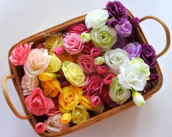 May include: A wicker basket filled with a variety of artificial flowers in shades of pink, yellow, white, purple, and green. The flowers are arranged in a random pattern, creating a colorful and vibrant display.