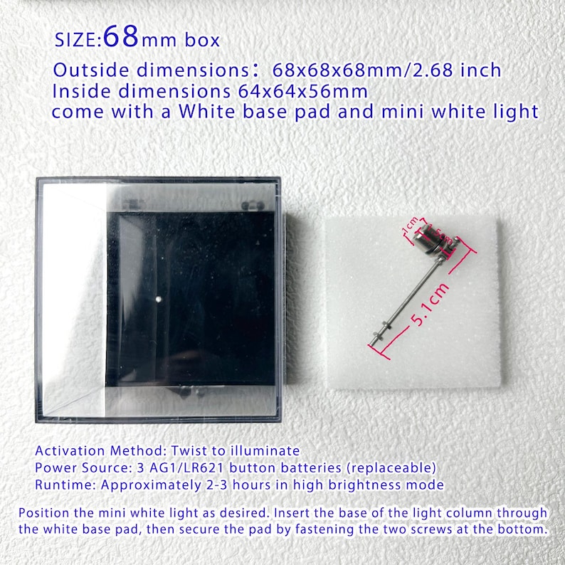 May include: A clear plastic box with a white base pad and a mini white light. The box dimensions are 2.68 inches. The light is 5.1 cm long and 1 cm wide. The text on the image says "SIZE: 68mm box".