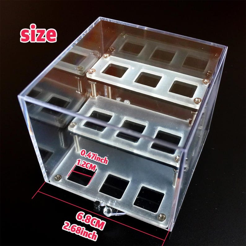 May include: A clear acrylic display case with a size of 17cm by 6.8cm by 3cm. The case has two shelves and is perfect for displaying small items.