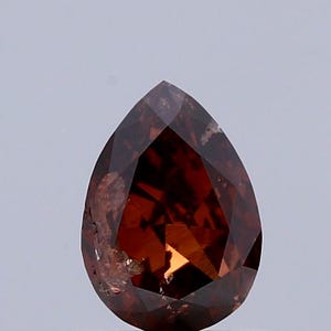 0.80 Carat Natural Fancy Dark Orange Brown color Diamond ,Pear Modified Brilliant Cut Diamond , i2 Clarity , For jewellery