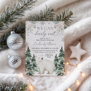 A white invitation card with a winter theme, featuring a polar bear and snowflakes, surrounded by Christmas decorations and lights.