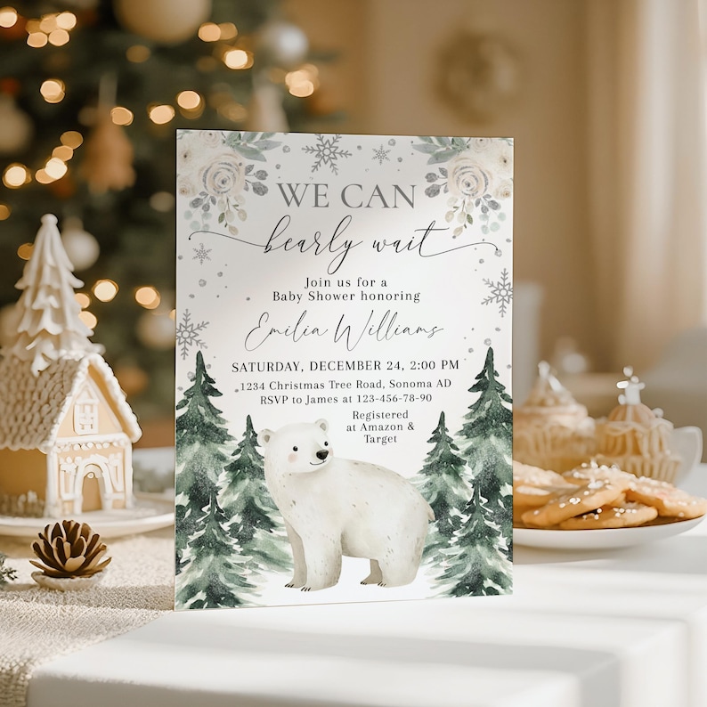 The image is a baby shower invitation featuring a polar bear and a snowy forest scene, with a white background and a festive, wintery theme.