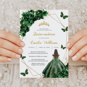 May include: A Quinceañera invitation with a gold and green color scheme. The invitation features a gold crown, butterflies, and a green floral design. The text on the invitation reads "Quinceañera" and "Emilia Williams".