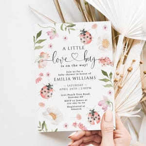 May include: A baby shower invitation with a floral and ladybug design. The invitation reads "A Little Love Bug is on the Way!" and includes event details for Emilia Williams, April 24th at 2:00 PM.