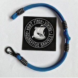 Thin military bracelet made of paracord and carabine for men. Royal blue collection. Navy style.
