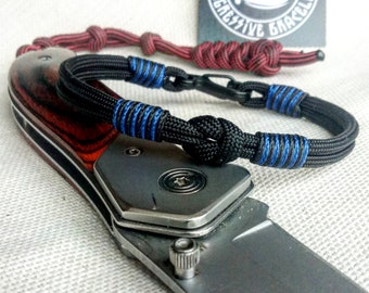 Thin military bracelet made of paracord and carabine for men.  Army style.