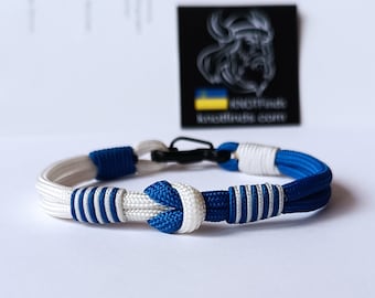 Pulsera solidaria de Israel. Bandera de Israel. Pulsera fina de paracord con carabina. Brazalete azul real y blanco. Confeccionado en cordón y nudos celtas.