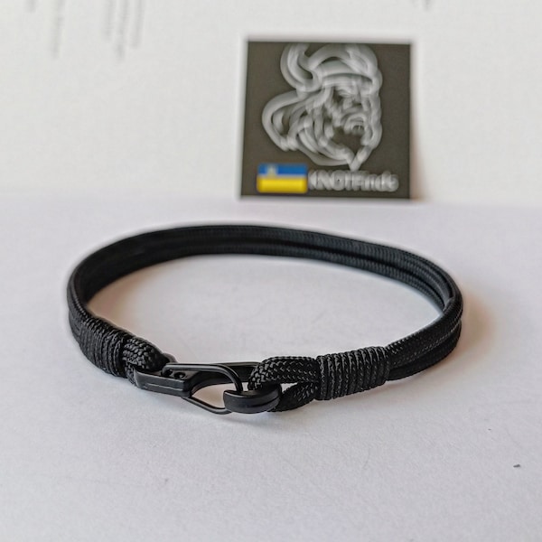 Thin black paracord and carabiner bracelet.  Unloading camp.  Surfer bangle. Extreme durable.