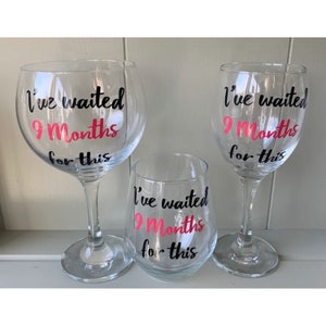 clear wine glass and gin glass with black text that reads "I've waited 9 Months for this" in pink and black lettering.
