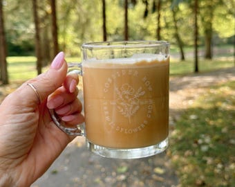 Consider how the wildflowers grow. glass mug. laser engraved. logo. sale. dishwasher safe. business logo. zehr engraving. custom engraving.