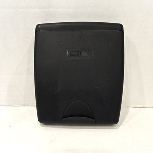 May include: Black plastic case with the text "Case Logic" printed on the front.