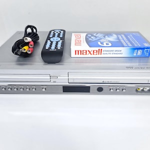 Zenith VCR Combo 4-Head Stereo Video Cassette with DVD Player XBV442 With New Cable Blank VHS Video Tape Universal Remote