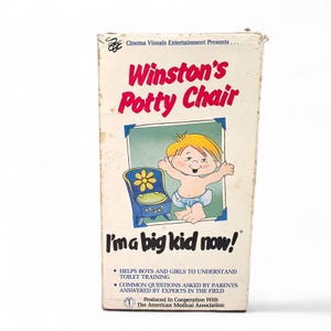 May include: A vintage VHS tape titled "Winston's Potty Chair." The cover features a cartoon illustration of a baby and a blue potty chair with a flower design. Text includes "I'm a big kid now!" and information about toilet training.