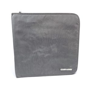 May include: A square, charcoal gray zippered storage case with rounded corners. The exterior is made of a durable, textured fabric material. A small, rectangular black label with the white text CASE LOGIC is attached to the bottom right corner.