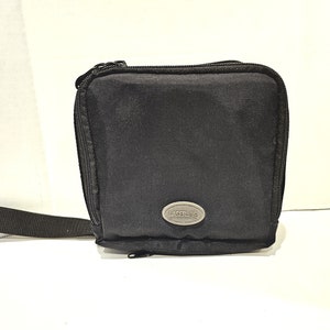 May include: Black zippered carrying case with a gray "LASERLUBE" logo.