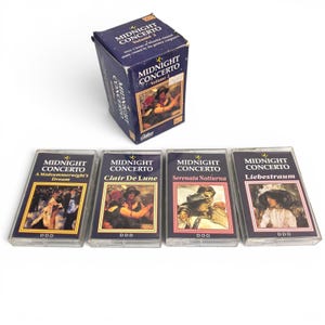 May include: A Midnight Concerto Volume 2 cassette tape box set featuring four individual clear plastic cassette cases. Each case displays a unique classical music title including A Midsummernight's Dream, Clair De Lune, Serenata Notturna, and Liebestraum.