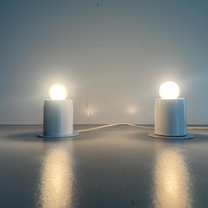 Minimal Design Pair of White Metal Wall Lamps Still of Artemide, 1970s, Italy