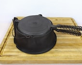 Lodge 8, High Base, Cast Iron Waffle Iron with pin hinge and offset, Alaskan Coil Handles. Very Good Used Condition