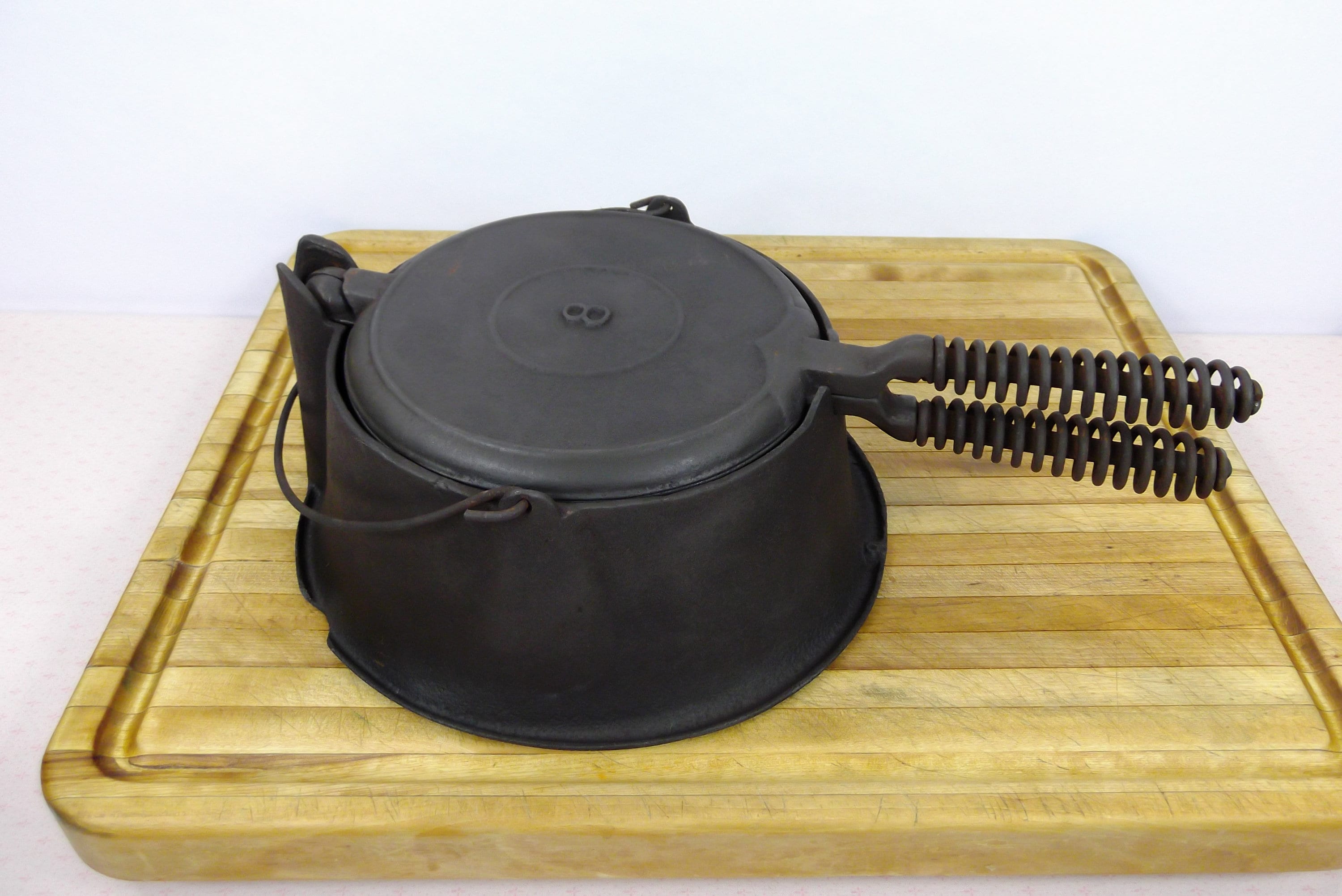 Lodge # 8, High Base, Cast Iron Waffle Iron with pin hinge and offset,  Alaskan Coil Handles. Very Good Used Condition