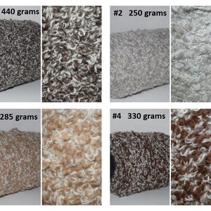 May include: Four skeins of textured yarn in various colors. The skeins are labeled with their weight in grams. Colors include gray, light gray, tan, and brown. The yarn has a curly, fluffy texture, ideal for knitting or crochet projects.