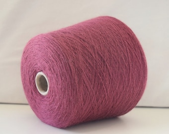 May include: A skein of deep pink yarn, wound into a ball shape.