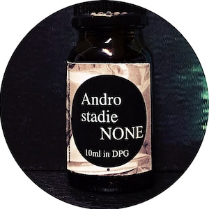 May include: A small, dark brown glass bottle with a white label. The label has black text that reads "Andro stadie NONE 10ml in DPG".