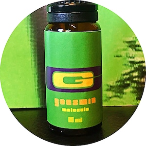 May include: A small, clear glass bottle with a green label. The label has a purple and yellow graphic of the letter "G" and the text "goodsin molecule 10 ml".
