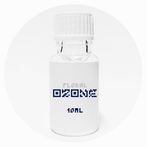 May include: A clear glass bottle with a white label and a white cap. The label says "Floral Ozone" and "10mL".