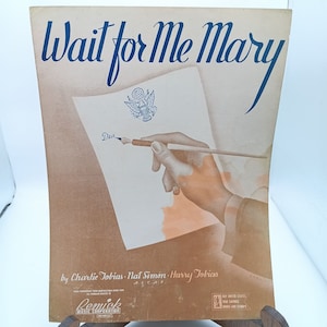 May include: A vintage sheet music cover for the song "Wait for Me Mary" featuring a hand writing a letter with a pen. The letterhead has a seal with the US Army insignia. The sheet music is published by Remick Music Corporation.