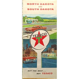 May include: Vintage Texaco travel brochure for North Dakota and South Dakota. The brochure features illustrations of classic cars, gas stations, and the Texaco logo with a red star and green "T". The text reads "Buy the best... Buy Texaco."