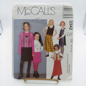 May include: A sewing pattern for girls' clothing, sizes 12-14-16. The pattern includes a skirt, vest, and top. The pattern is from McCall's and the pattern number is 3342.