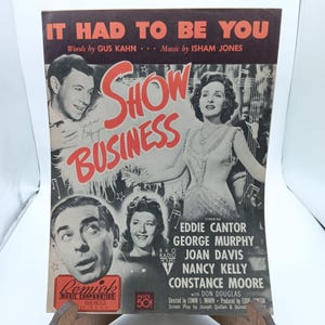 May include: A vintage sheet music cover for the song "It Had To Be You" from the 1945 musical film "Show Business". The cover features a black and white photo of Eddie Cantor, George Murphy, Joan Davis, Nancy Kelly, and Constance Moore. The title "Show Business" is in red letters.