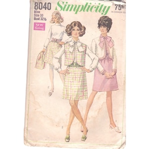 May include: Simplicity sewing pattern number 8040 for a dress with a vest. The pattern is for a size 10 with a 32 1/2 inch bust. The dress is shown in a pink and green plaid fabric and a solid pink fabric. The pattern is 75 cents.