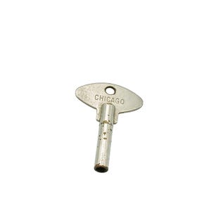 May include: A vintage metal key with a flat, oval head and a cylindrical stem. The word "CHICAGO" is stamped on the head. The key has a small hole near the top and shows signs of wear.