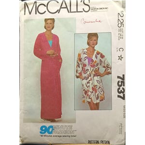 May include: A McCall's sewing pattern envelope showing a woman in a pink robe and a floral robe. The envelope includes the text "90 Minute Fashion" and the pattern number 7537. The pattern is for a petite miss size.