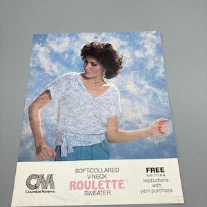 May include: A vintage knitting pattern featuring a woman wearing a soft-collared V-neck "Roulette" sweater. The pattern includes free knitting instructions with yarn purchase. The design is in shades of blue and white.