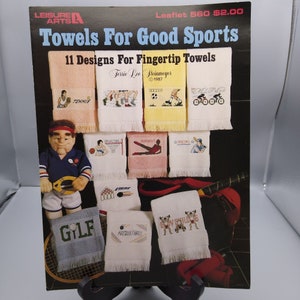 Wzory do haftu krzyżykowego Vintage, Ręczniki dla Good Sports autorstwa Terrie Lee Steinmeyer, Ulotka Leisure Arts 560, Broszura do robótek ręcznych 1987 Fintertip