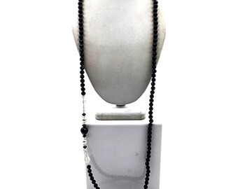 Collana vintage con perle sfaccettate nere, perle finte e dettagli trasparenti