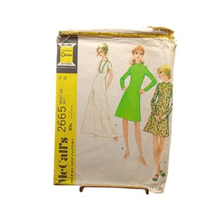 May include: Vintage McCall's sewing pattern 2665 featuring illustrations of three dresses. The pattern includes a yellow and green label with the text "McCall's" and "Quickie". The pattern is for Misses' size 14, bust 36.