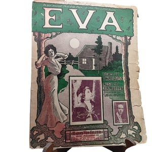 May include: Vintage sheet music cover for "Eva" featuring a woman in a long dress, a cabin, and the moon. The cover includes the text "To our mascot, Miss Eva Puck, of the Two Little Pucks" and the names of the composer and lyricist.