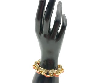 Vintage armband med emalj och strasskedja i guld och orange färg från Banana Republic
