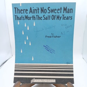 May include: A blue sheet music cover with a white raindrop design. The title is "There Ain't No Sweet Man That's Worth The Salt Of My Tears" by Fred Fisher. The price is $2.00.