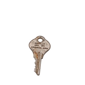 May include: A vintage metal key with a worn, aged appearance. The key has a circular hole at the top and a jagged edge for the teeth. The text "DOUGLAS MFG. DIV. BRONSON, MICH." is stamped on the key.